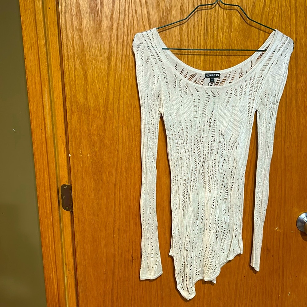 Express xsmall women’s sweater. Beige & fitted, bottom has asymmetrical hemline.